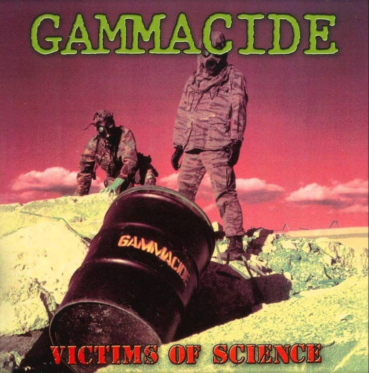 Cover of Gammacide's Victims of Science: two figures in gas masks and camouflage on a yellow, chemical-stained hillside under a red sky, with a black barrel stencilled Gammacide